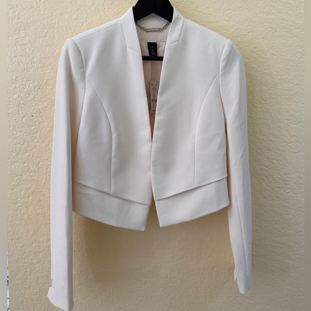 White House Black Market jacket. Brand new with tag. Size 00 Color cream